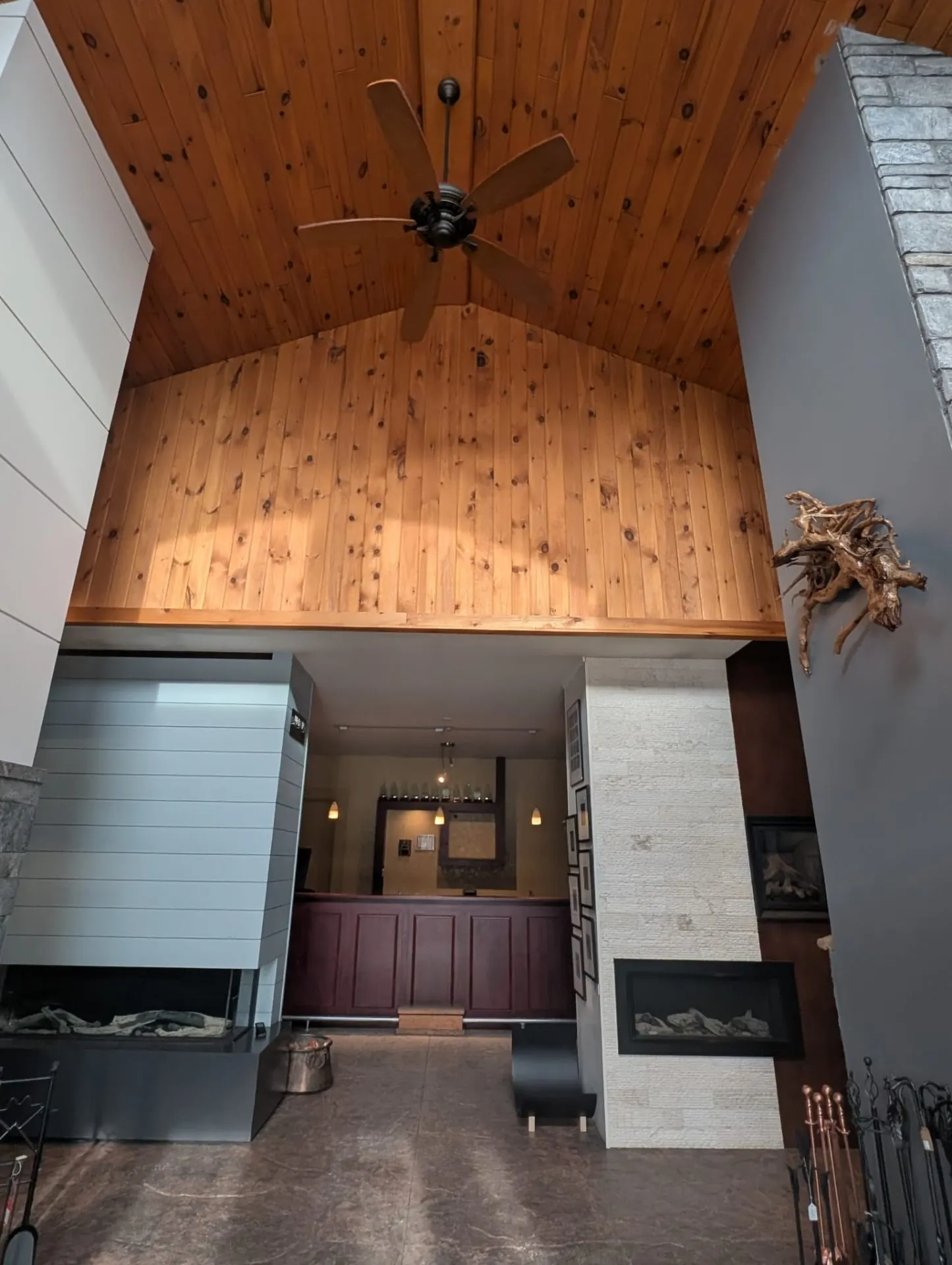 Vaulted pine ceiling above the Fireplace Stop North showroom floor